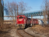 CP TH11 crosses the diamond at Irondale in Hamilton's north end, with a drag of empties from Bell & MacKenzie. 