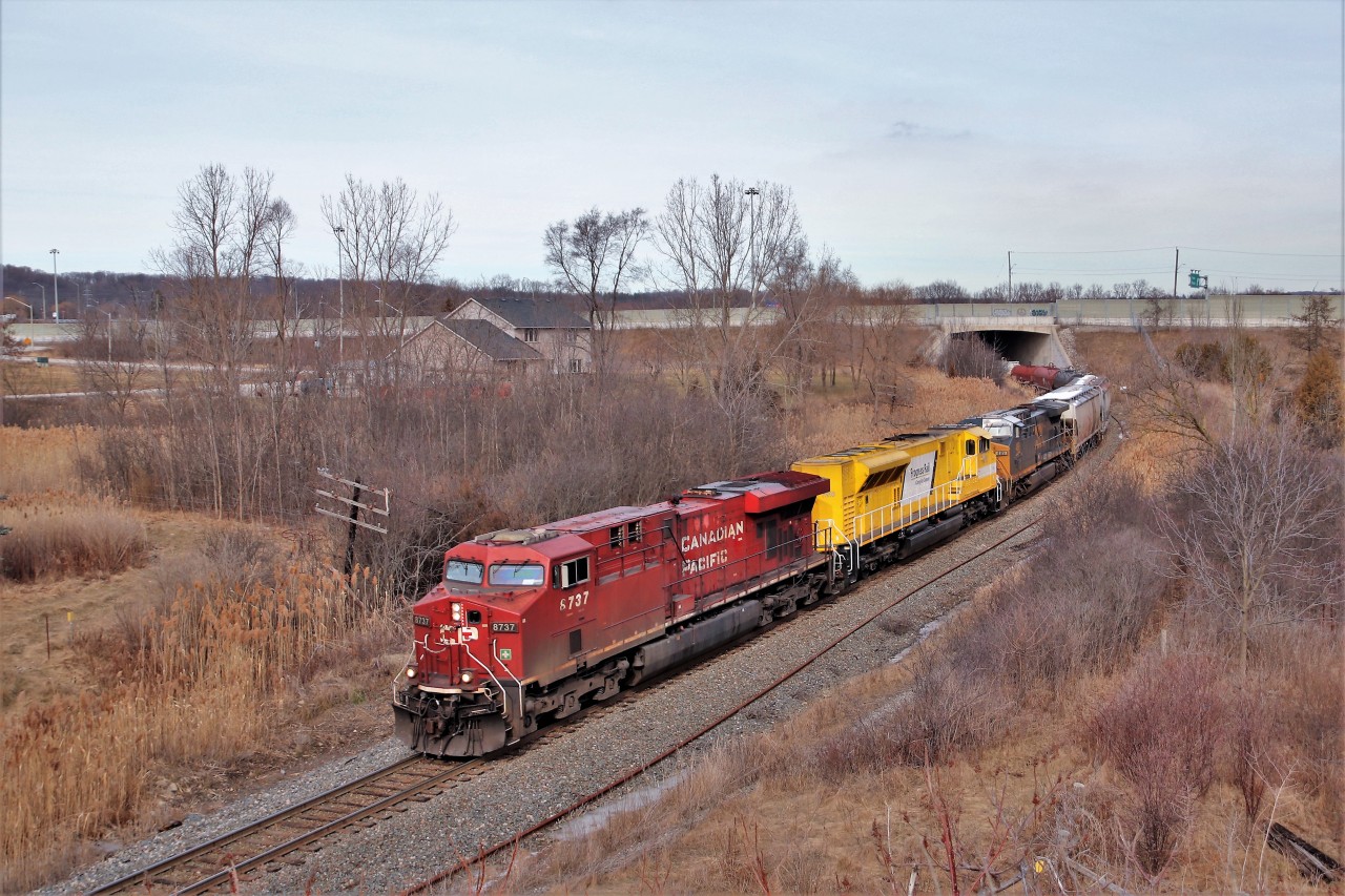 Newman Road is a really nice spot to shoot southbound Canadian Pacific trains and today was no exception. A colorful set of power brought the railfans out to get their shots of CP 246. With CP 8737 on point and EMDX 7210 and CSX 489, the rumble out from under highway 6 as they descend the steep grade on their way to Desjardins and a meet with CP 247 at Aberdeen.