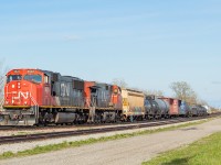 CN L561 has just returned from the BPRR over in Buffalo, and after leaving their cars from the BPRR on the main at Duff (shown <a href="http://www.railpictures.ca/?attachment_id=42808" target="_blank">here</a>), are tying onto <a href="http://www.railpictures.ca/?attachment_id=43871" target="_blank">the setoff just left by NS C93</a>. The dirt biker at right is a fairly common sight while railfanning in Niagara - with no shortage of quad/dirt bike trails in the vicinity of the tracks throughout the Region.