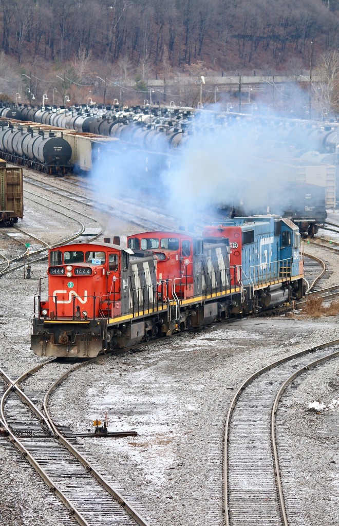 This is definitely a lash up I figured I would never see, but lately it seems anything is possible. Hamilton yard lately has become an interesting place to catch the unexpected. A few years ago it seemed we had most likely seen the end for CN's unique GMD-1's, but thankfully, especially in Southern Ontario that isn't the case. I'm not complaining about GTW painted units adding some colour to the sea of black on CN either. Here we see a pretty unique consist throttling up and heading into the yard to grab another cut of cars, while adding to Hamilton's fresh and clean air, LOL!