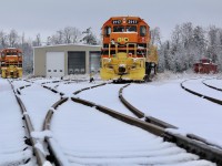 
A light blanket of snow covers a good portion of the lifeless rails on the north side of Guelph Junction. Mother nature has created a winter wonderland while Goderich Exeter's power slumbers over the holiday weekend. It would appear that the new tenant of the Guelph Junction Railway has yet to be legally allowed within the former Ontario Southland engine house at the junction, as all power still sits outside since taking over operations here. The doors of the engine house are still coated with Alco soot leaving me with fond memories of years gone by. Former Ontario Southland van 4900 sits on an empty track in the distance after being refused shipment to OSR's Salford shop, thanks to riding on friction bearing trucks. Thankfully the old caboose has now been donated to a historical society and will be spared the scrappers torch. 