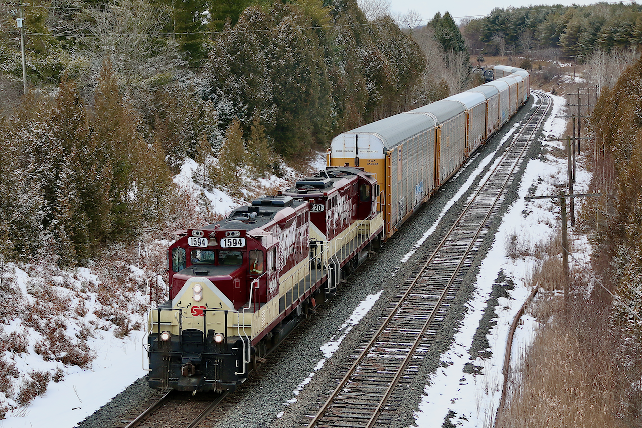 It has been a long time since I have heard the sound of a pair of GP9U's working the Galt subdivision. After loosing CP's MLW fleet the GP9U's quickly became the second best thing, and have been deeply missed since their retirement. This location half way along Coakley siding is one of my favourite spots near Woodstock, and even though the location is on CP I only ever seem to catch OSR here. Thankfully OSR picked up a few GP9U's a few years ago so I don't have to travel too far to get my fix. The GP9U's look sharp in OSR paint, maybe even better the the CP paint they last wore. The pair are about to duck under the entrance to Pittock Conservation area as they head their train to the siding east of Coakley. From there they will return back to Woodstock to lift some cars and head for home.
