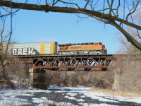 The minus 19 windchill was worth bearing considering the motive power. After a quick stop at Hornby yard, CP train 244 is on the move again as it cruises over the Credit River. 