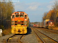 A three way meet at first line as GEXR 582 has just arrived from Guelph and is putting their train away, 147 rustles fall foliage as they bolt for Wolverton on the south track, and T69 waits in the background on the North Track for everything to pass before they head west following somewhat behind 147. It was mostly cloudy before and after the trains passed, so I was darn lucky that the sun played ball at the right time.