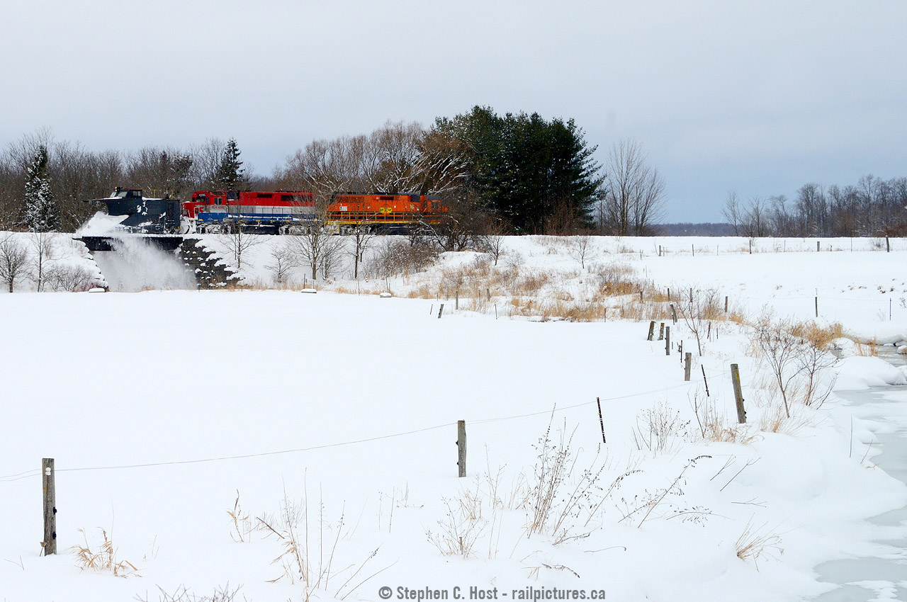 North of Hensall is the small town of Kippen, where a small bridge crosses the Bannockburn River. As the first GEXR plow to run on the Exeter sub in 14 years heads southward, snow falls off the bridge into the frozen river below.