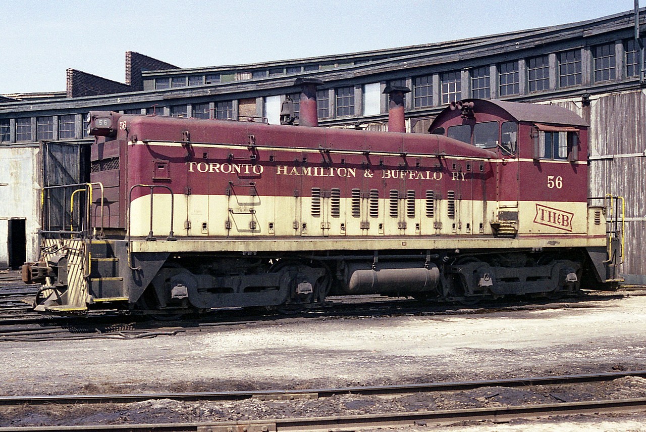 Nice sunny morning image of the TH&B 56 sitting outside the roundhouse on Chatham St near Aberdeen. This unit, built in 1950; was one of four SW9 switchers on the TH&B roster at the time. It was retired in 1988.