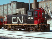 CN EMD SW1200RSm 7300 awaits assignment at Kitchener on February 25th, 1990. Built as CN 1382 in April 1960, it currently resides at Exporail in green and gold paint with its as delivered number 