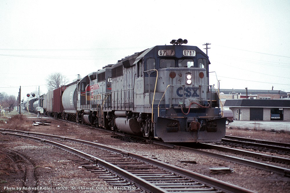 CSXT GP40 6787, and a Seaboard painted Geep approach Ross Street with R320 on March 16th, 1990
