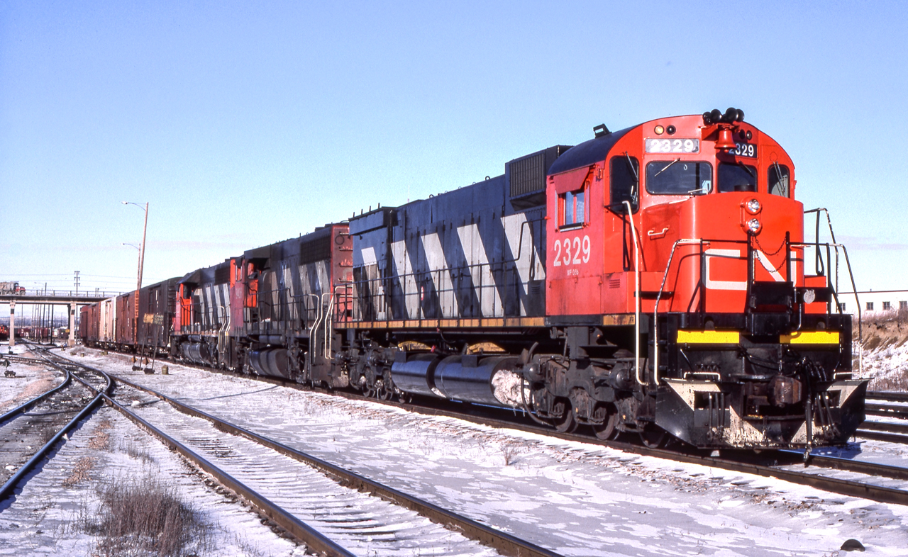 Peter Jobe photographed CN 2329 with train #396 at Maple, Ontario on December 13, 1986.