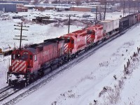<br>
<br>
 my,  my  !
<br>
<br>
 Quite the CP Rail sight....love that multimark, and only forty short years since...
<br>
<br>
 Montreal 1970  built  M-636  #4734 'pulls ' ( ! ) brand new GMD 1981 built SD40-2's  #5987 – #5988  on an eastbound departing London town
<br>
<br>
 Maybe that crew preferred the ALCO powered MLW ride ?
<br>
<br>
 on the approach to Nissouri, CP Rail Galt subdivision,  January 17, 1981 Kodachrome by S.Danko
<br>
<br>
 More interesting happenings on the Galt: 
 <br>
<br>
<a href="http://www.railpictures.ca/?attachment_id= 8760">  entertainment provided by the big M's  </a>
<br>
<br>
 sdfourty
