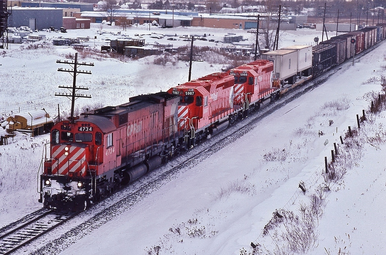 my,  my  !


 Quite the CP Rail sight....love that multimark, and only forty short years since...


 Montreal 1970  built  M-636  #4734 'pulls ' ( ! ) brand new GMD 1981 built SD40-2's  #5987 – #5988  on an eastbound departing London town


 Maybe that crew preferred the ALCO powered MLW ride ?


 on the approach to Nissouri, CP Rail Galt subdivision,  January 17, 1981 Kodachrome by S.Danko


 More interesting happenings on the Galt: 
 

  entertainment provided by the big M's  


 sdfourty