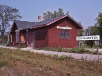 <br>
<br>
 the Victoria Railway opened to traffic 1876 (Lindsay to Kinmount), original VR station replaced by this GTR 1910 built station
<br>
<br>
 Victoria Ry acquired by the Midland Railway 1882 and then the GTR 1893 and to the CNR 1923, official Haliburton Sub  abandonment 1981, tracks removed 1983
<br>
<br>
 Today, 2021, the station is in situ, partially restored operating as a seasonal Art Galley / Tourist office
<br>
<br>
 at Fenelon Falls (ex mile 14.04 Haliburton Sub.) , September 13, 1982 Kodachrome by S.Danko
<br>
<br>
 