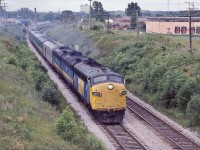 <br>
<br>
 The combined VIA Rail trains #44 #54 #2
<br>
<br>
 yes! Three trains in One, and yes, Daily !
<br>
<br>
 a k a   Capital   Lakeshore   Canadian   Canadien
<br>
<br>
 FP9A #6532, a GMD 1957 product, leads the combined VIA on the approach to CN Scarborough Junction
<br>
<br>
  It is a humid, hot morning on the Birchmount overpass July 25, 1982 Kodachrome by S.Danko
<br>
<br>
 noteworthy
<br>
<br>
 those westbound signals are for the GECO branch junction mile 327 Kingston subdivision 
<br>
<br>
 upper right: note the GECO branch Milne Ave level crossing
<br>
<br>
  This is one of  VIA's experiments to reduce transcontinental train costs, no Sudbury switching for the separate Toronto and Montreal sections:  82 83 84 the Ottawa valley trains were tri weekly Budd cars, Sudbury to Ottawa, by June 1, 1985 the Sudbury switching resumed with the Toronto section trains #9 and #10 
 <br>
<br>
<a href="http://www.railpictures.ca/?attachment_id= 7292">  colourful  </a>
<br>
<br>
<a href="http://www.railpictures.ca/?attachment_id= 39856"> open auto racks  </a>
 <br>
<br>
<a href="http://www.railpictures.ca/?attachment_id= 9727">  more Birchmount views  </a>
<br>
<br>
<a href="http://www.railpictures.ca/?attachment_id= 16833">  more three in one  </a>
 <br>
<br>
 sdfourty

