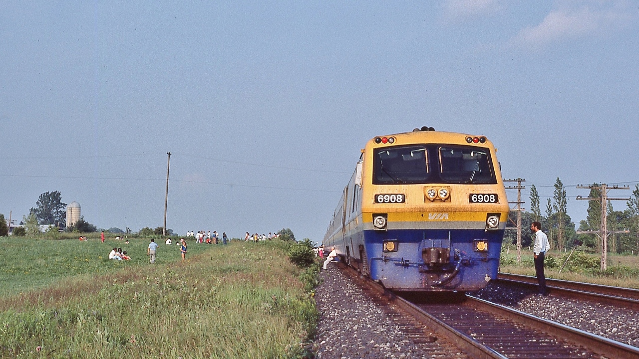 What a wonderful Sunday for a …....picnic........ 


 ...an electrical mishap created....what you see here... between Newcastle and Newtonville...


 ...near mile 280, Kingston Sub, LRC powered VIA train #66 RAPIDO on July 25, 1982 Kodachrome by S.Danko


 fortunately:


 …..fortunately freight traffic – at that time - was nil......


…..fortunately VIA operates frequent daily eastbound service....


….. fortunately VIA trains – in that era -  operated with extra equipment to handle last minute ticket sales....


…..fortunately  VIA #56  BONAVENTURE, is scheduled 45 minutes after #66....


….fortunately....and ironically,  VIA #56  powered by:  three  M L W  's  !  ( that pic to be posted )


...oh my ! BUT it was a really nice Sunday for a picnic...


sdfourty