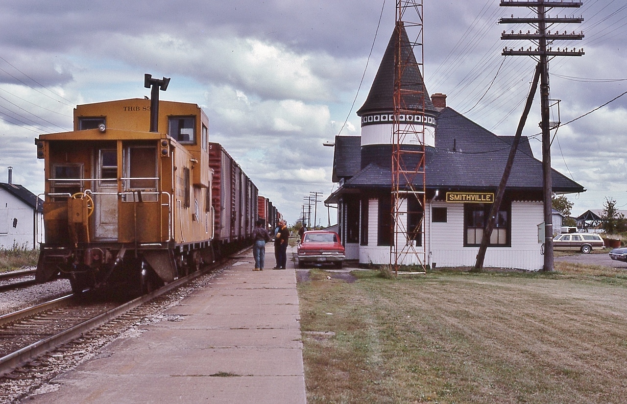 the crew, aboard TH&B van #83, exchanges information on the platform 


 with a single unit, TH&B #74 east  is, perhaps, the Port Maitland job ?


 At TH&B Smithville,  September 16, 1982 Kodachrome by S.Danko


 more TH&B
 

    eastbound at Bayview   
 

 noteworthy: at the far right is the Parisienne Atlantica fresh from  'The Rock' 
 

 sdfourty