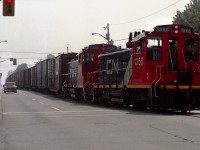 Running north on Ritson Road, mile 1.9 of the Oshawa Railway, SW1200RS 1366 and 1339 run the red light at Bond Street as they approach the General Motors North Plant.  Unfortunately, I didn't note the date I shot the photo, but the rails were removed in 1998.