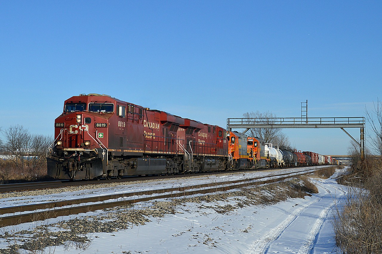 Thanks to a heads up (and a Sightings Group report) I headed out to try for a shot of the two WCOR (Wellsboro & Corning RR) units supposedly on their way to the Quebec Gatineau Rwy. Location I chose is at the end of Pietz Rd, as it dead-ends at the tracks.  Power is CP 8819, 8849 WCOR 309, and 307. Both units still in their former QNSL paint, although one can see a rather poor attempt at 'rebranding' the locos as the paint has worn thru.
I understand the units were dropped at Welland yard.