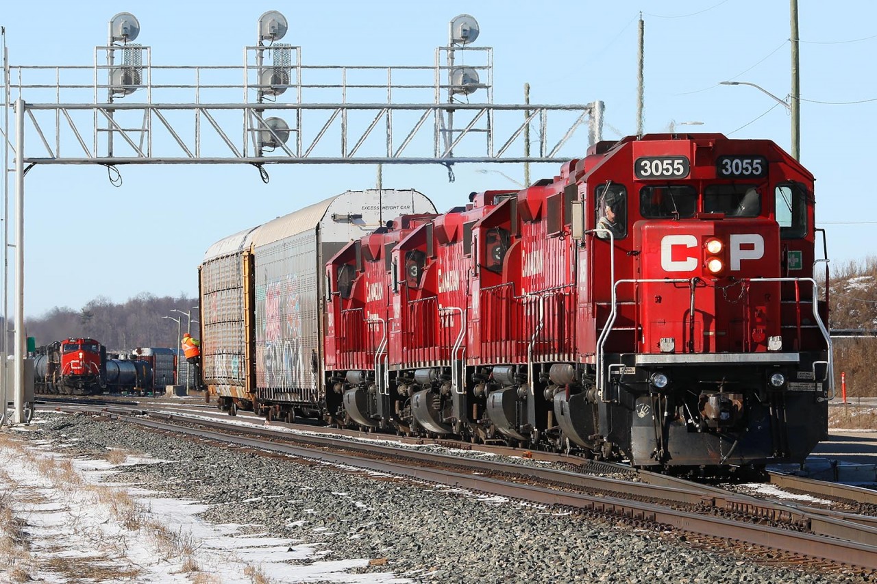 Railroading harmony as T72 prepares to grab another track full of racks for Toyota; creating a train that, before the bridge would have blocked downtown Galt for 15 minutes or more. In the background, 244 with CN 2682 leading prepares to couple onto another 50 racks growing their train to 10000 feet.
