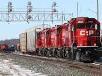 Railroading harmony as T72 prepares to grab another track full of racks for Toyota; creating a train that, before the bridge would have blocked downtown Galt for 15 minutes or more. In the background, 244 with CN 2682 leading prepares to couple onto another 50 racks growing their train to 10000 feet.