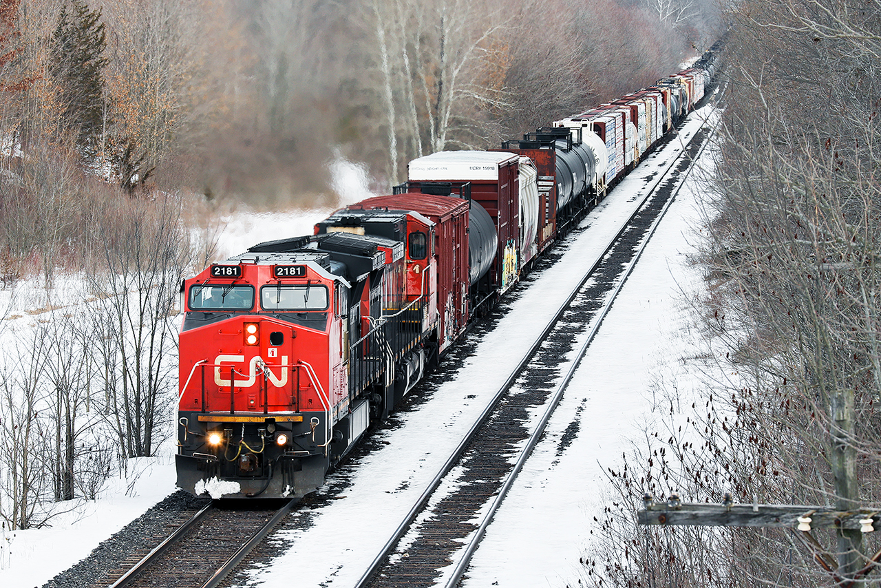 161 cars hang on the drawbars as 2 senior members of CN's GE family...2500 was the other are making good time getting home to London