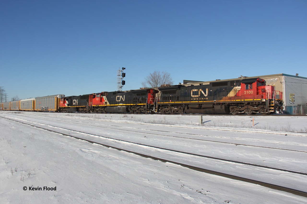 CN 570 has had this power set for several weeks but I was only able to properly shoot it this nice and sunny winter morning (CN 2100-2629-5699). I took a chance and set up at Burlington West, a place I have rarely visited. I was worried that it would be fenced off and inaccessible for a proper photograph. However, I was pleasantly surprised to find it wide open. I love the blue sky and the snow cover!