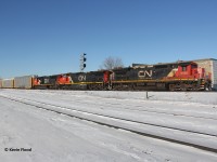 CN 570 has had this power set for several weeks but I was only able to properly shoot it this nice and sunny winter morning (CN 2100-2629-5699). I took a chance and set up at Burlington West, a place I have rarely visited. I was worried that it would be fenced off and inaccessible for a proper photograph. However, I was pleasantly surprised to find it wide open. I love the blue sky and the snow cover!