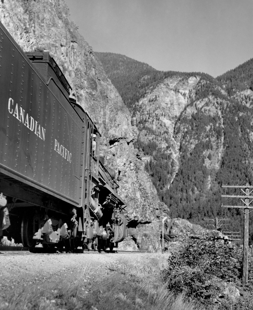 CP 5326 with 38 car wayfreight at mile 26, just east of Yale eastbound.  About to enter first tunnel east of Yale.  Small diagonal sign ahead of engine says "SLOW".