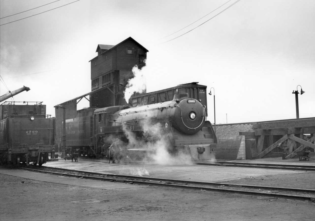 CP engines 2700 (tender) and 2861 being cleaned at Vancouver.  Drake street yard.