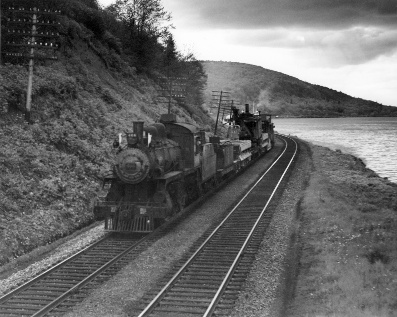 CP extra 486 east at Barnet with a work train.  Side dump car and steam shovel possibly used to clean out ditches.