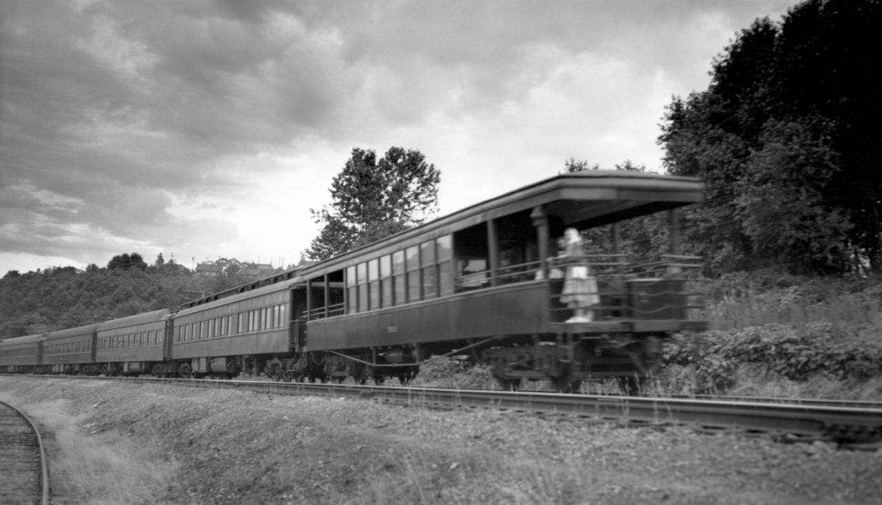Observation car on unknown passenger train leaving Vancouver.  Engine was 2704 shown in previous photo.