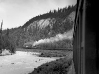 Train no. 4 with R class helper and T-1-b road engine in lower Kicking Horse canyon.  Exact locomotive numbers and location unknown.  Train had 15 cars.