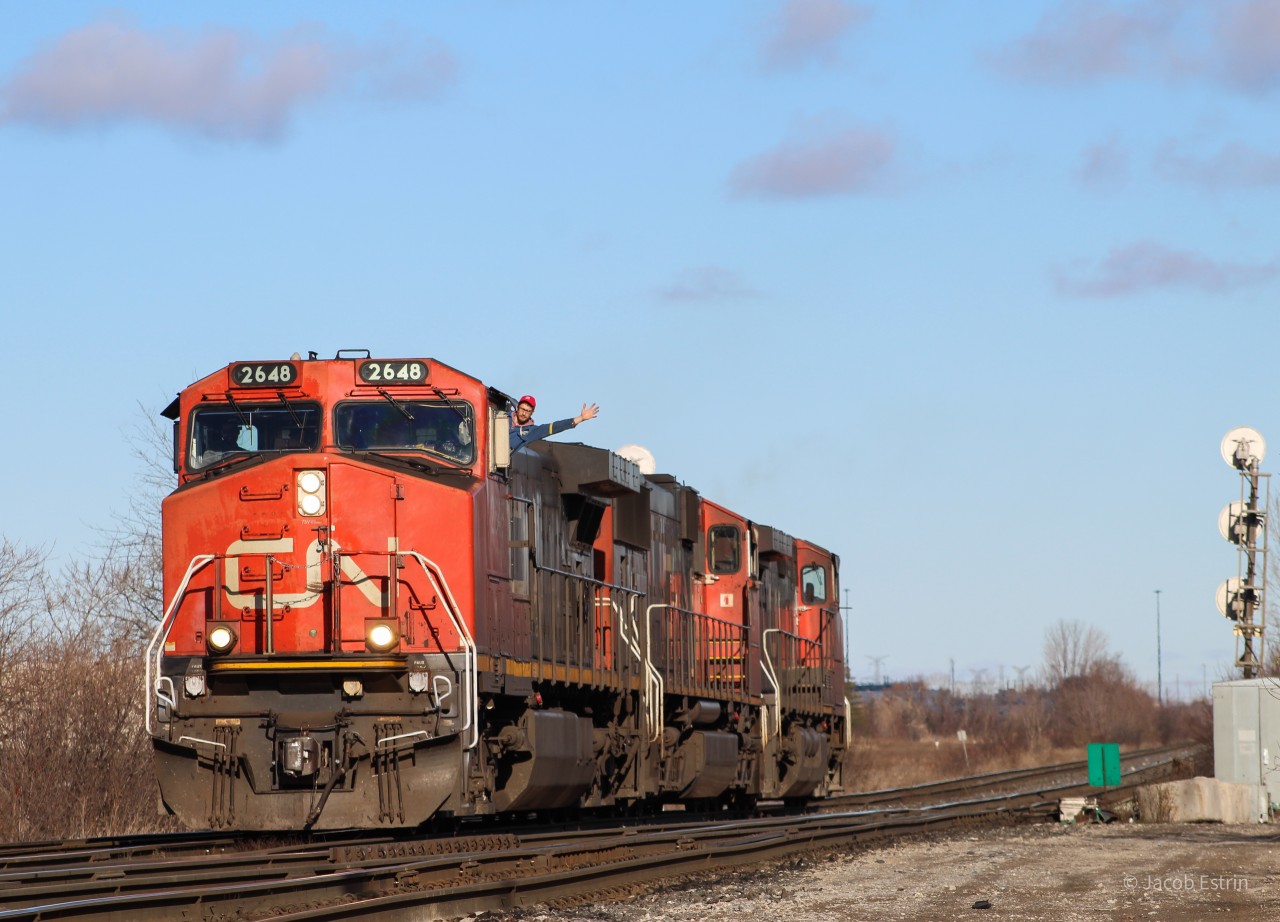 CN Z148's light power seen at Goreway Avenue with a very happy conductor hanging out the window to say hi!