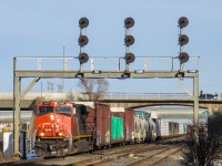 A piece of history...
CN M305 powers up underneath the searchlights at CN Liverpool in Pickering Ontario. These searchlights have now been replaced by LED "vaders" as of February 7th, 2021; so this shot is now impossible. A great artifact of Canadian railroading, watching these signals disappear is sad to see, but I'm glad I was able to make it out there before they were gone for good.