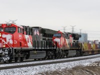 CN 105 rounds the bend near Mile 15 York sub with "veterans" unit CN 3015 leading "CN 100" CN 3220. 105 is a few miles from Doncaster Junction where it turned to go north and eventually west towards British Columbia. 