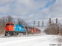 CN M305 passes through the town of Brockville, with the Grand Trunk Western Heritage Unit taking the lead. This is one of the 6 units CN has in the heritage paint representing the heritage of the old Railroads CN has purchased over the years. 