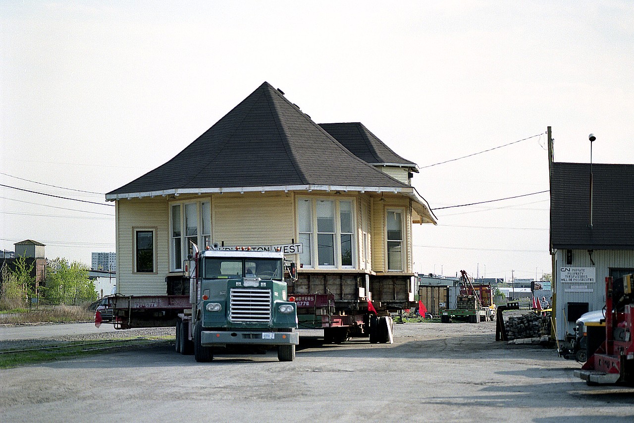 Saved !!!!  Well, we all knew the situation was getting more promising than it had been once the old CN Freeman Station at Burlington West was up and loaded and ready to roll.
In this view ABRA Co has this rather oversized load all set to be carefully transported to a temporary location "just around the corner" to a lot on Fairview Av between the old Beach Sub overpass and the Fire Station. Since then the completion of the station's preservation has been nothing short of remarkable. It is beautiful, and well worth checking out.
It was not always smooth sailing though. So many ideas as to what to do with the structure came and went. There was talk of a Chamber of Commerce building, a bath house down on the Beach, a concession stand, and all kinds of other suggestions over the years.

In the end, the Friends of Freeman Station took charge, and a permanent foundation was poured.

When covid-19 has packed its bags and gone off into the sunset (we hope!) it would be a day well spent to visit the station on one of its' Open House days and see the remarkable job done here. Or join the group, "FOFS" (Friends of Freeman Station) and help with continuing restoration. Track is down, the grounds need work, and the organization is presently in a serious hunt for rolling stock to compliment the property. To know more about the organization......  info@freemanstation.ca   

This is truly a remarkable organization that succeeded against all odds. But it is not done yet. Donations still gratefully appreciated. As is a helping hand.