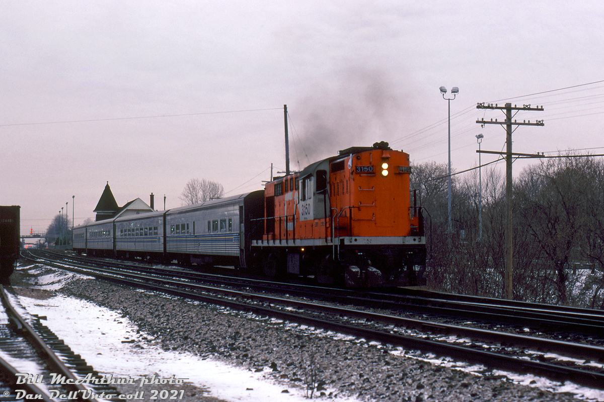 CN RS18 3150 leads a westbound VIA passenger extra with four Tempo cars, chugging away from its stop at Georgetown on the station track and about to re-enter the south main of the Halton Sub.

Bill McArthur photo, Dan Dell'Unto collection slide.

For some GO cab cars laying over that Bill shot on the same visit: http://www.railpictures.ca/?attachment_id=36457