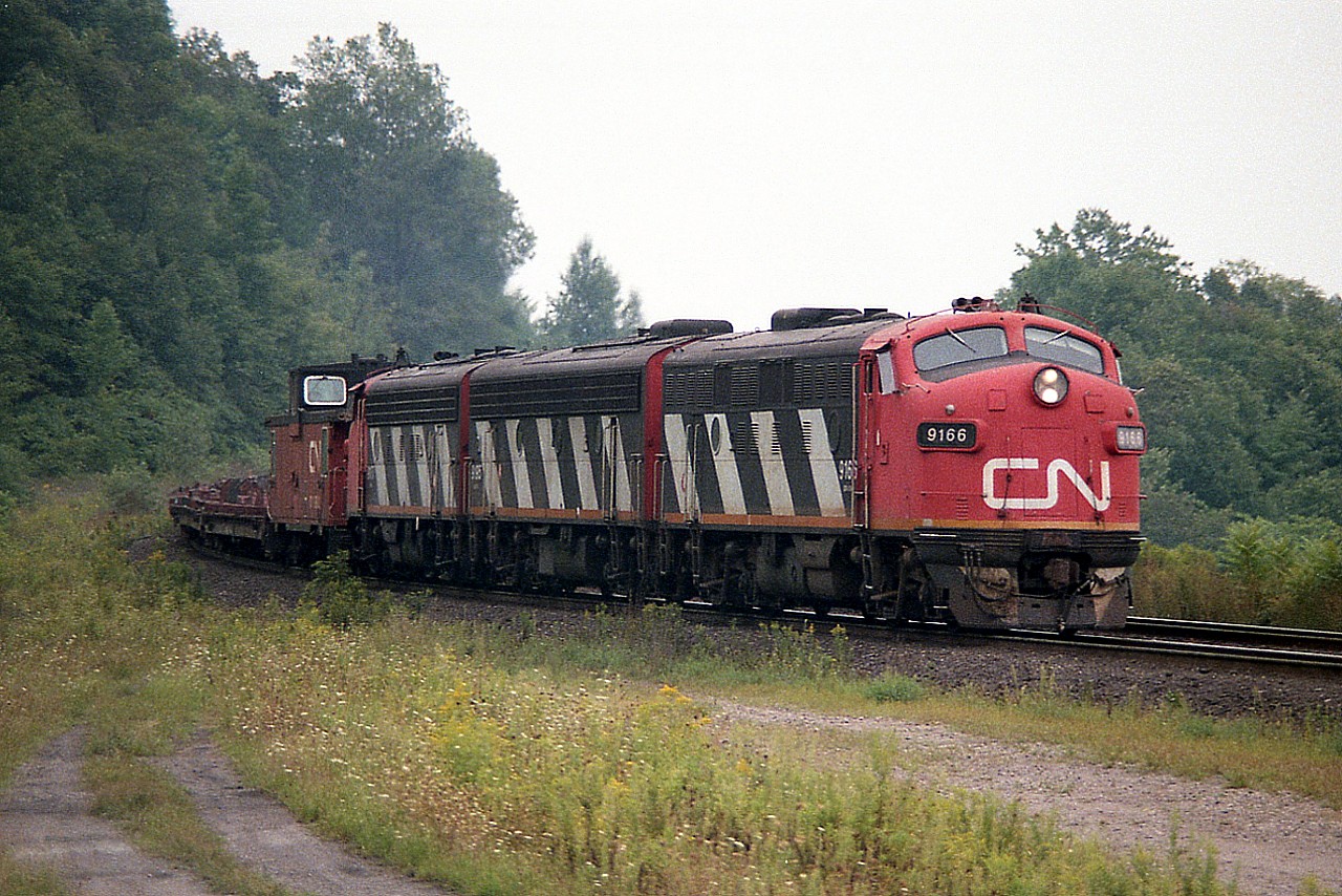 Late August 1986 was the very last time I witnessed the fan-favourite CN A-B-A combination on the Nanticoke Steel train #725. This edition features CN 9166, 9195 and 9177. The next time I had a chance to get out for it was Sept 2nd, and 4572 had subbed for 9177. Then by the 16th, 4520 subbed for 9195. Throughout September at least one or two of the old cab units were knocked out of the power consist. I guess this run took a toll on the old warriors.
 The view here is just before Dundas station, rather late in the afternoon. Too late for a chase.