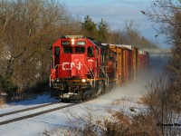CN L540 is westbound in Breslau on the Guelph Subdivision as it returns to Kitchener after lifting several hoppers from the large P&H Mill at Shantz Station on their way back from Guelph. Powering the train is GTW 6226 and 4028. December 29, 2020.