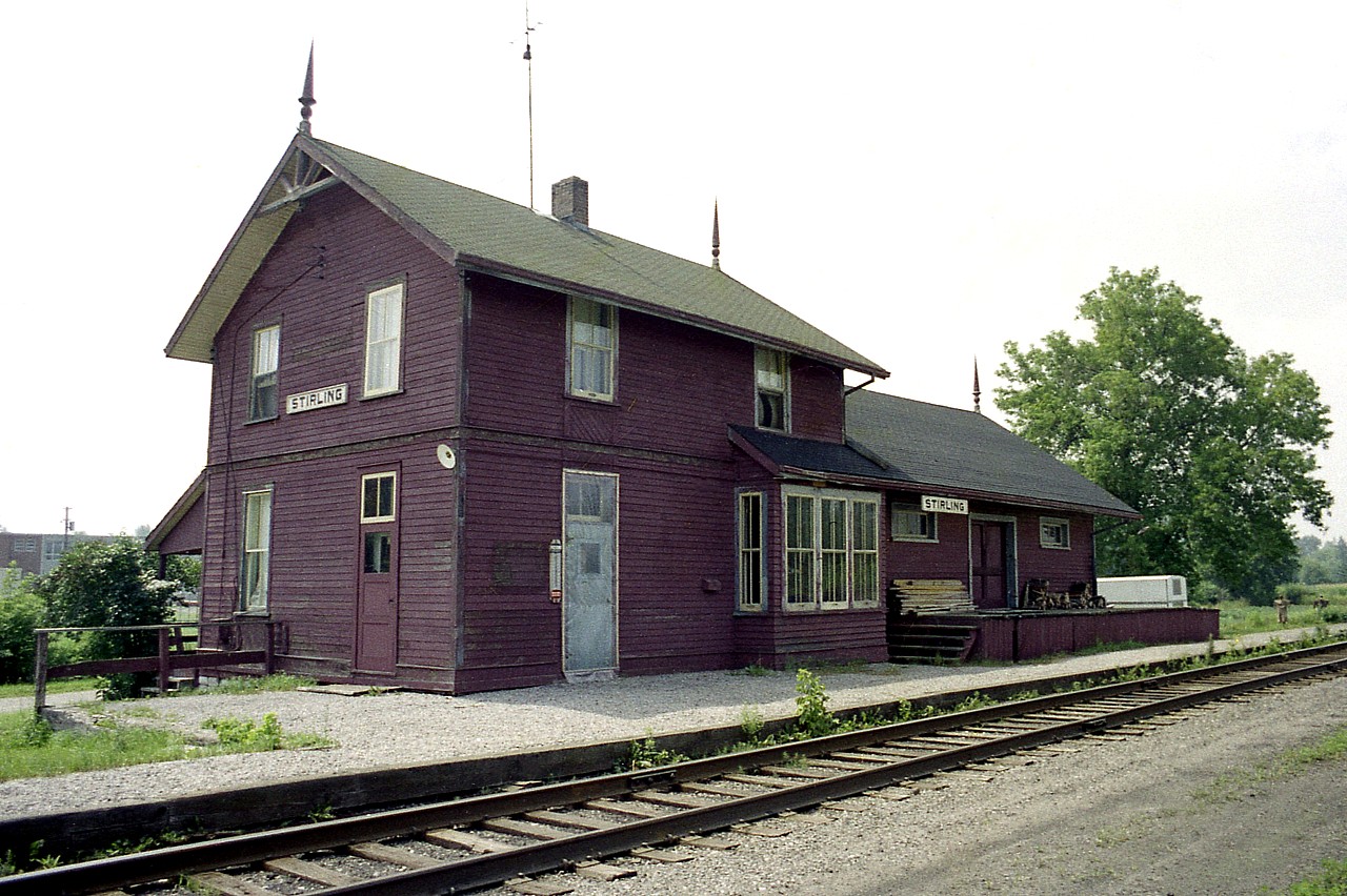 Save the Station !!! This whole town of 1500 or so people eventually were drawn into the drama. When CN closed the station in 1969, the last station master, D.C. Nunn, moved on to another location but his family stayed put in the old Stirling station until 1975, seeing it had comfortable living quarters upstairs and CN was not quite ready to demand it pulled down. But then CN stated making noise.
Enter Gary Miller, a Native artist......(I was really surprised to discover this in research, as he was a friend of mine when he lived in Burlington during our teenage years)......who thought the station would be a nice place to set up his studio and gallery. He approached the town to purchase it. The town balked, seeing going thru all the expense and then leasing it out to an artist who may or may not be willing to pay the bills from there on.
So nothing happened I gather that Gary let the idea go. 
But the seed had been sown, a rather lively group was formed and eventually became the Stirling Pioneer and Railway Historical Society and they convinced CN to hold on to the station past a deadline of April 30, 1985 while they worked out some way to purchase & restore the building. So they had one more year. Fund raisers began; "buy a button" campaign, bake sales and other promotions got the town council finally backing the idea to purchase and restore the station and the place was officially "saved" in October 1985. Restoration took place and Open House was a celebration on July 2, 1986.
It just goes to show what can be down when everybody gets involved. A beautiful piece of history. It sits attractively along the old right of way, now a walking trail. Not sure what occupies the structure at this time but last I heard it was to be an area museum. It has come a long way since the first train from Belleville rolled into town back in 1877.