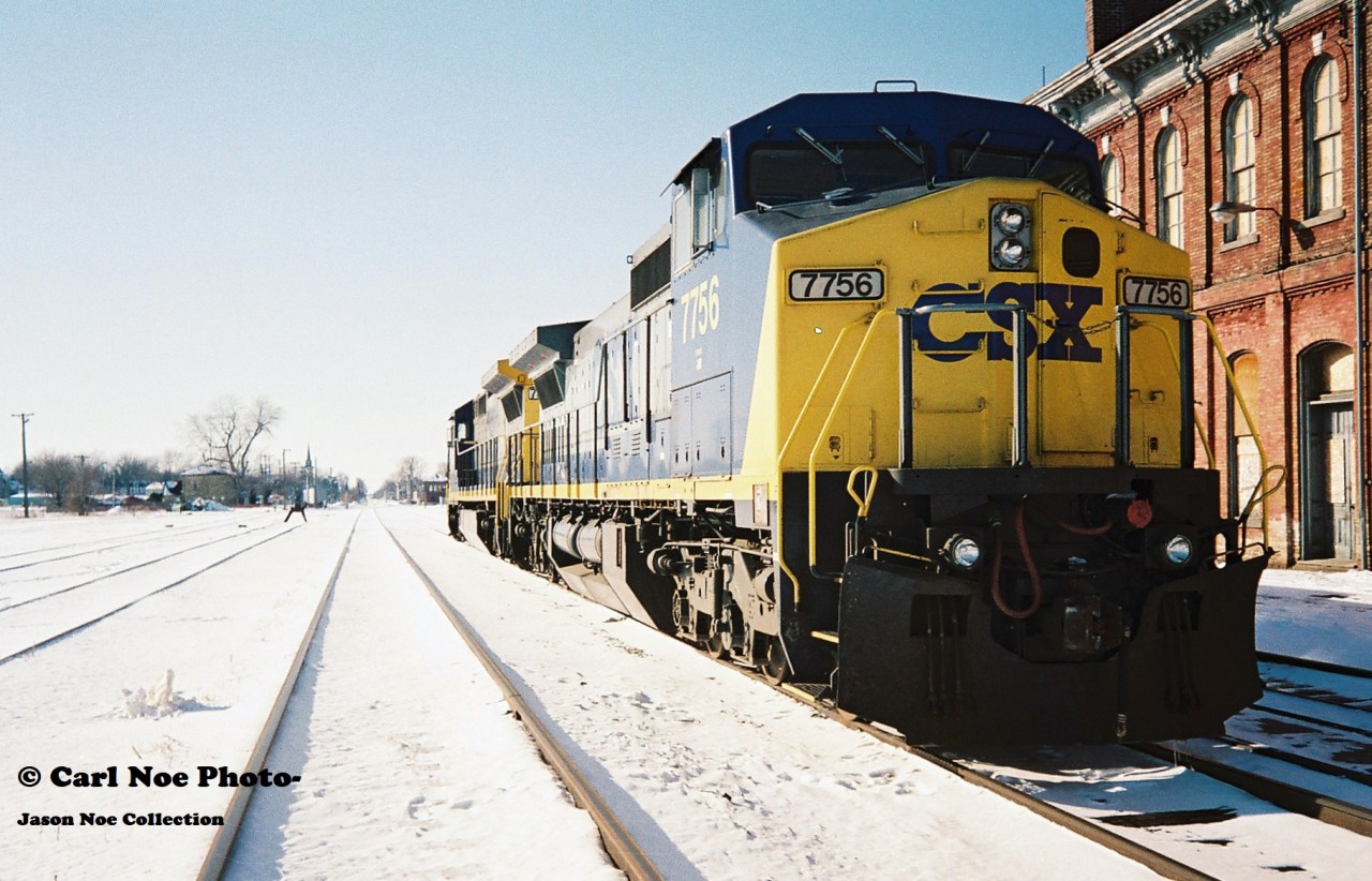 Here on an incredibly cold but sunny winter afternoon, CSX 7572 and 7756 are viewed idling beside the historic Canada Southern Railway station. This power was likely off CSX R320, which would tie-down here and not continue to Buffalo. Eventually it would become R321 simply departing St Thomas then it would ‘cab hop’ to Fargo, where it would lift all the traffic off the North end and continue to Windsor and Detroit.
