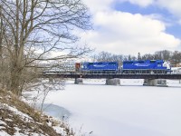Trundling across the Speed River on the 1857-built Galt & Guelph Railway (Great Western Railway) trestle, L542 works its way home to Preston with two cars for Gillies Lumber.