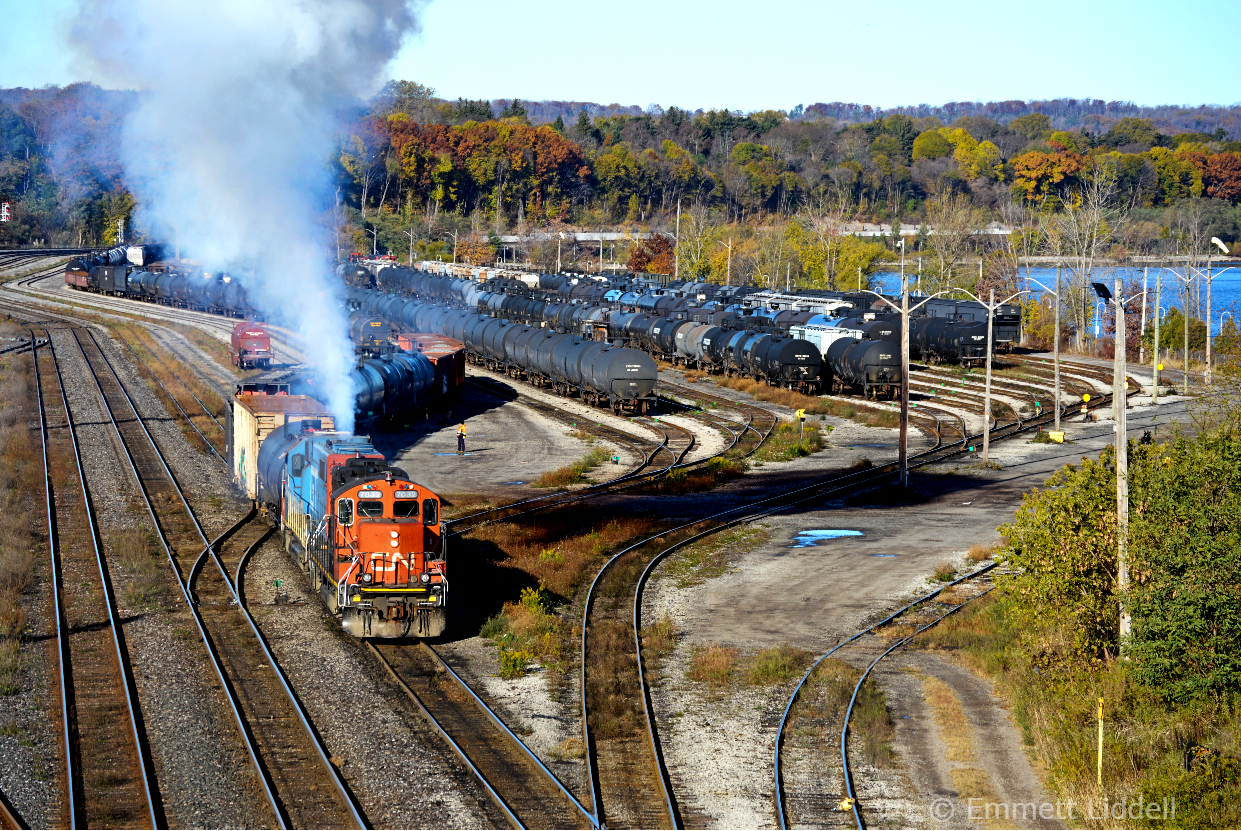 CN GP9rm 7032 & GTW 5849 give off a nice smoke show while switching out the yard on this bright and sunny November morning. 08:00 is seen switching out some cars before proceeding to Parkdale.
