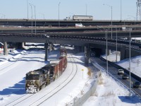 NS 7617 & NS 9845 lead a late CN 529 from out of the new Turcot interchange with 33 cars in tow.