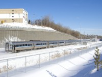 With the end of service on the electrified Deux-Montagnes commuter line and with the line already having been severed from the rest of the railway network last spring, the MR-90 cars that served on that line had to be trucked one at a time from Deux-Montagnes to Saint-Jérôme, where they were put back on rails. When enough cars accumulate, a train powered by an F59PHI is run and the cars head to the EXO yard in Pointe St-Charles. Here one of those moves is near the end of its run as it passes Turcot Ouest. 
