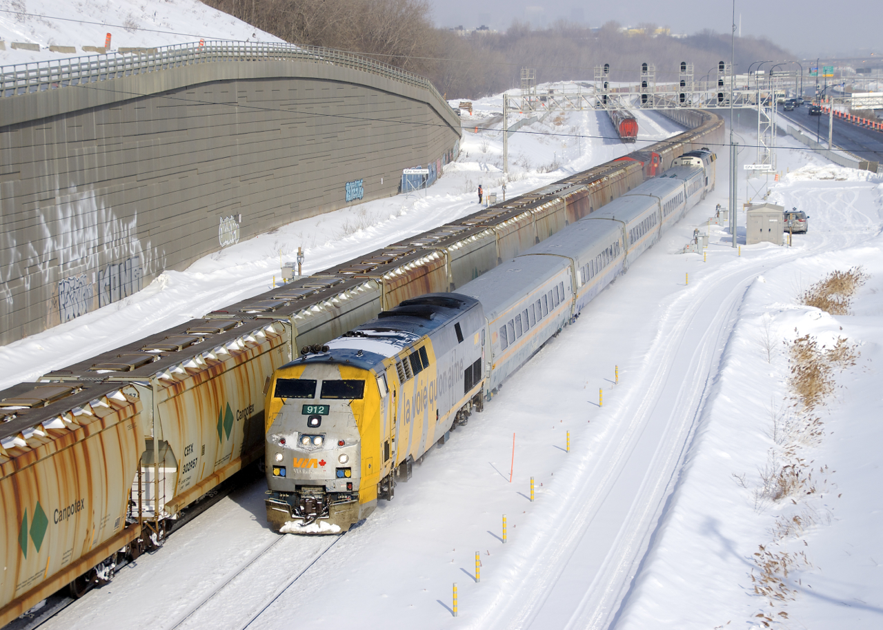 Potah train CN B730 is leaving Turcot Ouest after a crew change as VIA 67 passes with VIA 912 up front and VIA 900 shoving.