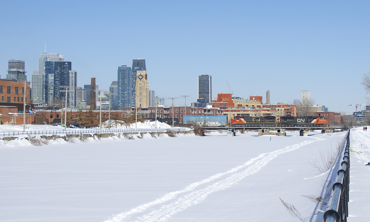 CN X306 has 113 cars and CN 5777 and CN 2008 for power as it crosses the snow-covered Lachine Canal.