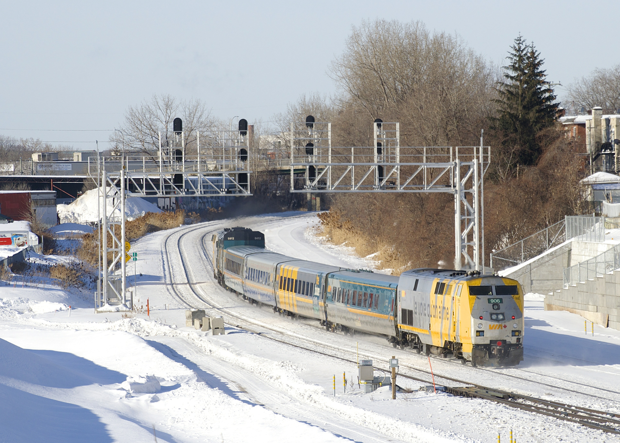 VIA 906 has its marker lights lit as it brings up the rear of VIA 63.