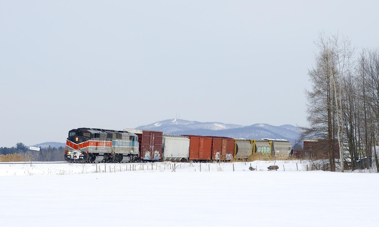 More than a year after CP completed its takeover of CMQ's Canadian lines, a solid set of CMQ power is surprisingly still the power on CP 251 as CMQ 9017 & CMQ 9011 lead past Station Mile Sign Brookport.