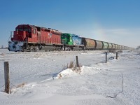 Modbil Grain's Last Mountain Railway has left home rails and is exercising trackage rights on the CN portion of of the Craik Subdivision near Bladworth Saskatchewan. Temperatures in the area were around -40C and if you look closely above the third car you can see a "sun dog" (basically a rainbow caused by ice crystals in the air). 